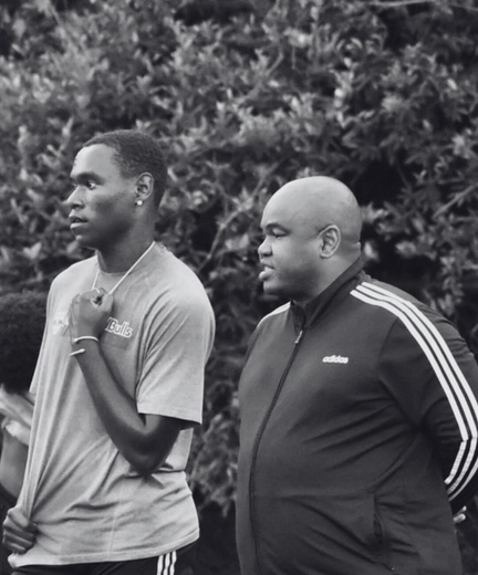 Vasco Da Lor coaches observing players on the field