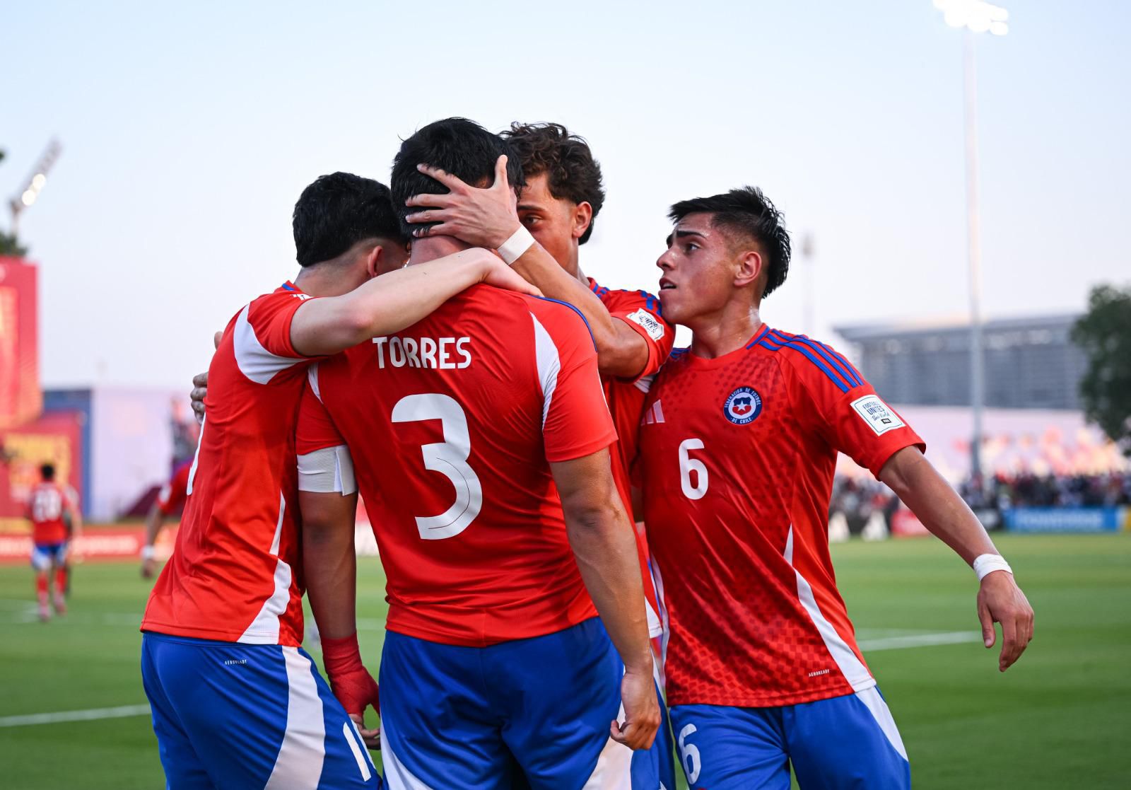 Zidane Yañez and his teammates celebrating for Chile